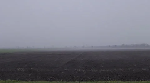 Fog flying over the fields early morning Video stock 63866322