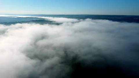 Fog hangs over hilly landscape in the Carolinas with Duke power plant in fa.. Stock Footage 247448761