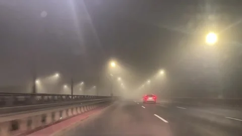 Fog on the highway when leaving the city of Szczecin at night Stock Footage 323069740