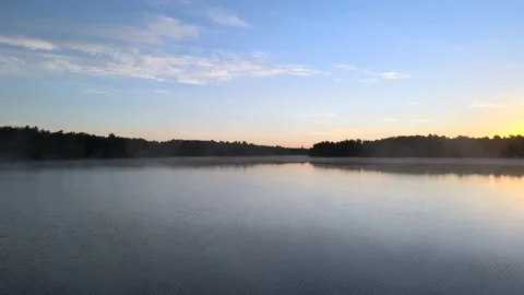 Fog on lake at sunrise Stock Footage 164308145