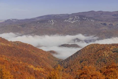 A fog in the middle of a mountain Stock Photos
