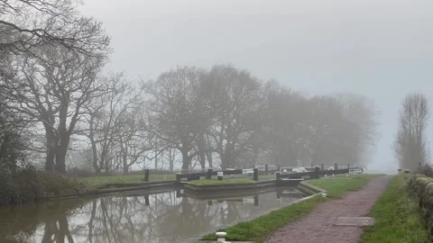 Fog mist canal lock water moody scene winter Stock Footage 297112460