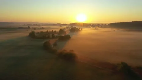Fog morning over the plain and river floodplain of the meadow near a village Stock Footage 203480675
