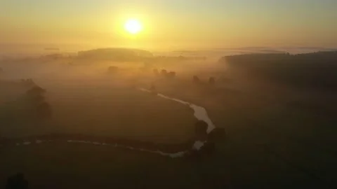 Fog morning over the plain and river floodplain of the meadow near a village Stock Footage 236490523