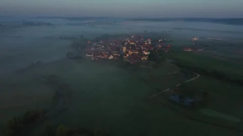 Fog morning over the plain and river floodplain of the meadow near a village Stock Footage 244087060