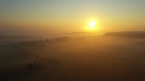 Fog morning over the plain and river floodplain of the meadow near a village Stock Footage 256626040