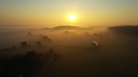 Fog morning over the plain and river floodplain of the meadow near a village Stock Footage 260112554
