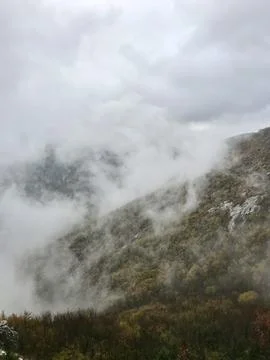 Fog in the mountains at sunset time Stock Photos