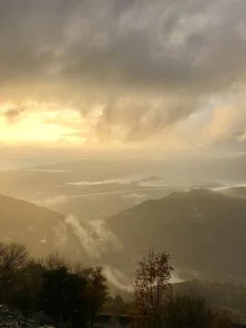 Fog in the mountains at sunset time Stock Photos