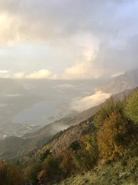 Fog in the mountains at sunset time Stock Photos