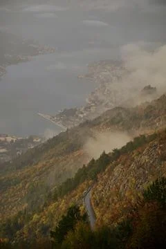 Fog in the mountains at sunset time Stock Photos