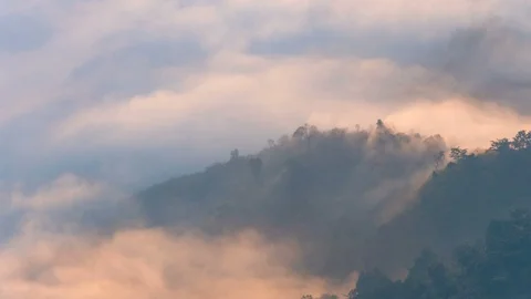 Fog moving covered mountain with sunlight, timelapse Stock Footage 104926223