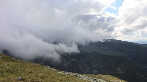 Fog moving fast on top of the mountain. Cold day Stock Footage 91446143