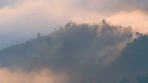 Fog moving over the mountain landscape in morning, timelapse Stock Footage 107085567