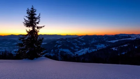 Fog moving over the mountain in winter with a star-shaped sky Stock Footage 115311381