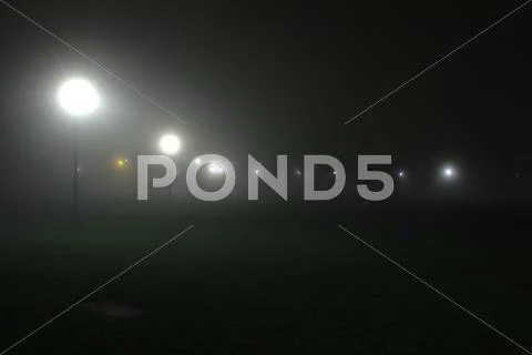 Fog in the night in the Meadows park in Edinburgh. Stock Photos