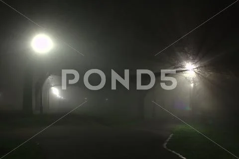 Fog in the night in the Meadows park in Edinburgh. Stock Photos