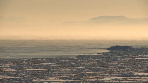 Fog in the ocean on the background of snow-covered hills Video stock 118912635