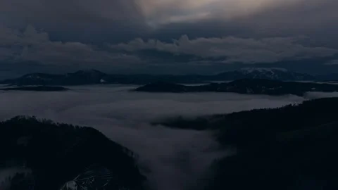 Fog ocean flowing between mountain ridges Stock Footage 328494352