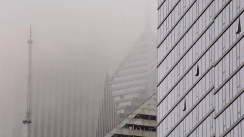 Fog or clouds moving through skyscrapers in downtown Chicago, Illinois Stock Footage 79697086