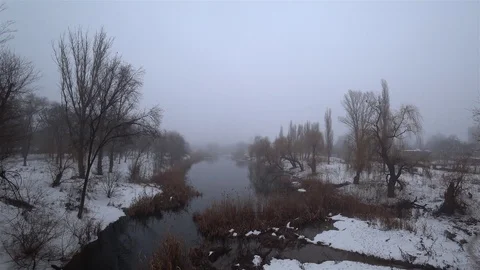 Fog over the current river in the park, snow, thaw, springtime. Top view. Stock Footage 102045767