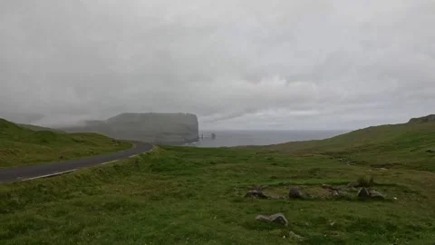 Fog over Eidiskollur cliff and Risin og Kellingin, Faroe Islands Stock-Footage 340005297