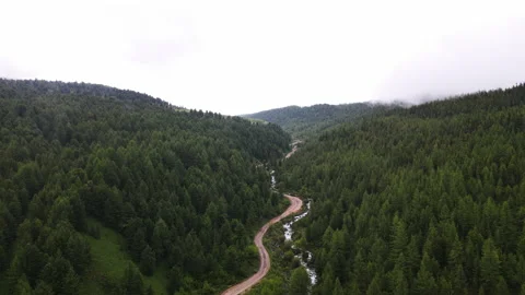 The fog over the hills is approaching. Drone footage Stock Footage 166062156