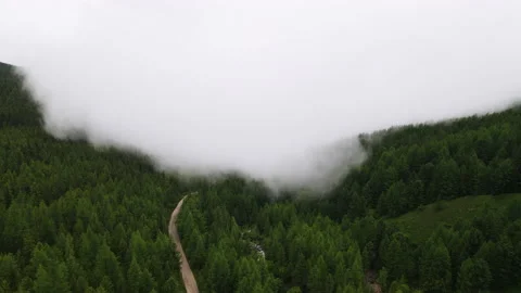 The fog over the hills is approaching. Drone footage Stock Footage 166062364