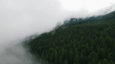 The fog over the hills is approaching. Drone footage. Static Stock Footage 166062370