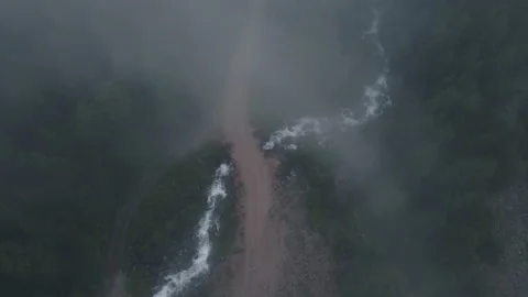 The fog over the hills is approaching. Drone footage Stock Footage 166062477