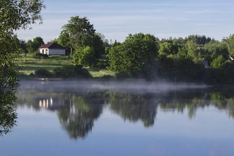 Fog over the lake. Stock Photos