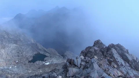 Fog over the mountain peaks Stock Footage 69990950
