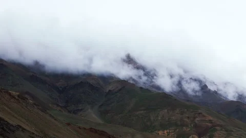 Fog over a mountain range in the Himalayas Stock Footage 303777277