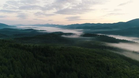 Fog over the mountains at sunrise Stock Footage 118630772