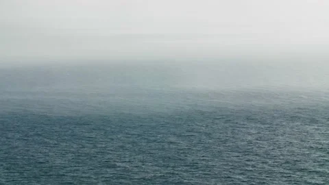 Fog over the rippling waves of the sea. Long shot taken with a tripod Stock Footage 218404954