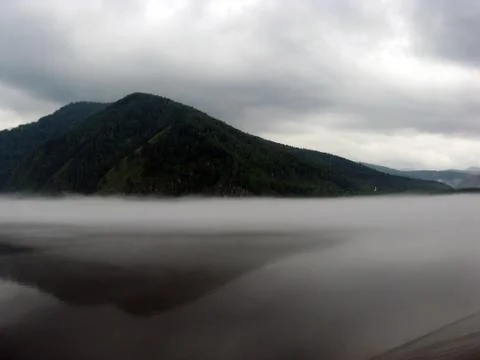 Fog over the river Stock Photos