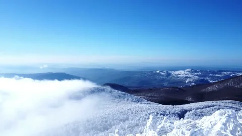Fog over snowy mountain 動画素材 232922538
