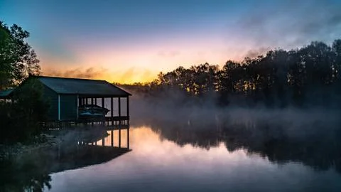 Fog over a still pond Stock Photos