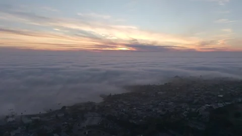 Fog Overtaking Coastline at Sunset Stock Footage 340579512