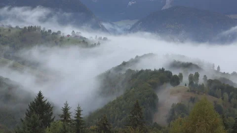 Fog passing over mountain peak, mister veil surrounded the nature, fast motion Stock Footage 141354879