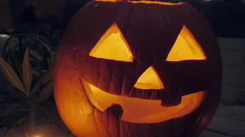 Fog Pours From a Lit Jack o'lantern Pumpkin Stock Footage 68948821