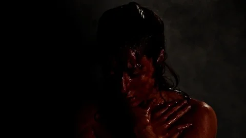 Fog rises and rain comes down on bloody person Stock Footage 99129150