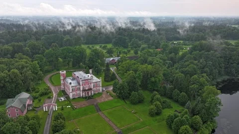 The fog rises from the forest ,Birini castle in the foreground Stock Footage 322763734