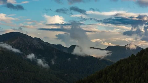 Fog Rises From Mountain Range During Sunset Stock Footage 146333131