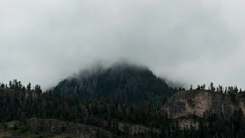Fog rising over a mountaintop Stock Footage 154898540