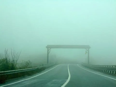 Fog on the road in the fall Photos