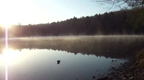 Fog rolling across the lake Stock Footage 4885617