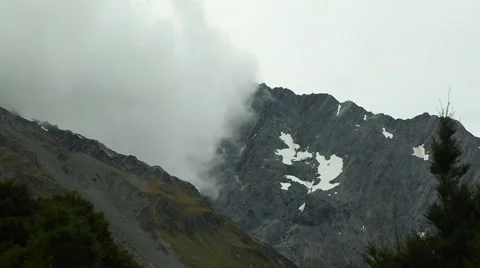 Fog rolling across mountain peaks in New Zealand Video stock 55529863