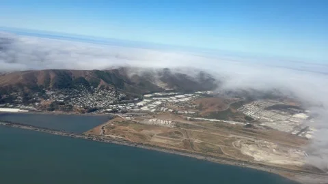 Fog Rolling Over Coastal Town from Above Stock Footage 285186052
