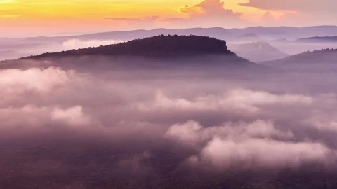 Fog rolling in over the hills at the Pha Mo e Dang in Srisaket Thailand. Time Stock Footage 92582337